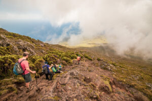 A group of people climbing Mount Pico on Pico Island at the Azores