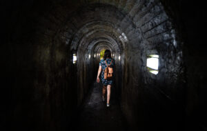 A woman entering the Natal cave in Terceira Island Azores