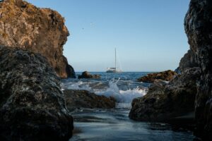 a yacht sailing off the island of faial in the azores